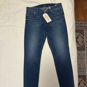 Dark wash skinny jeans, never worn. Just waited too long to return.